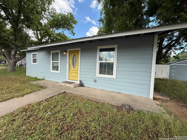 a house with trees in the background