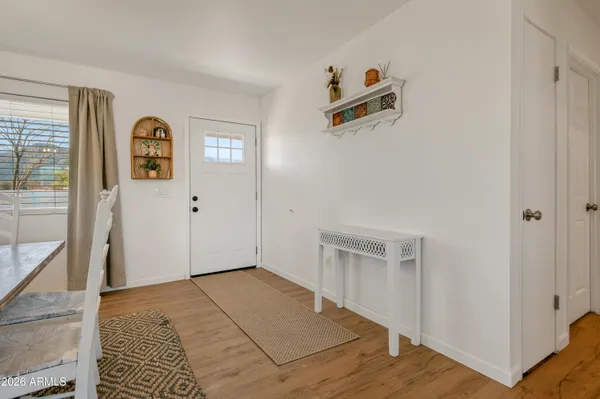 a view of a dining room with furniture window and wooden floor