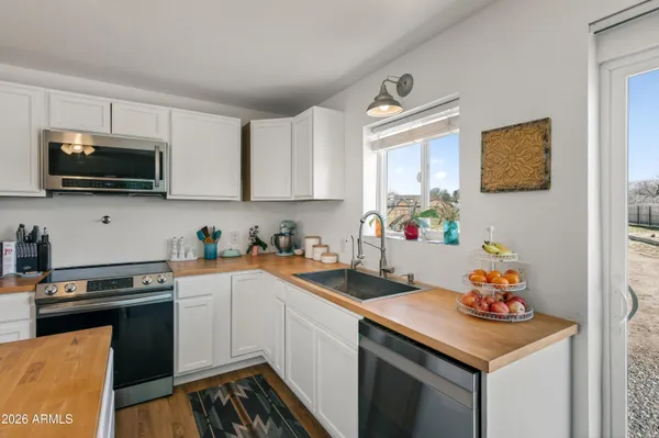 a bathroom with a sink vanity and a mirror