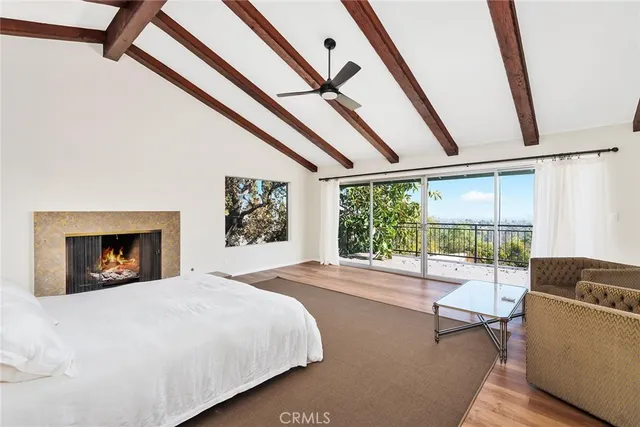 a bedroom with furniture and a fireplace