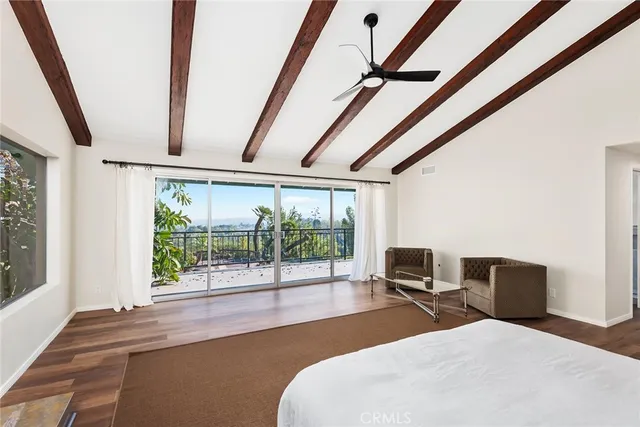 a bedroom with furniture and a window