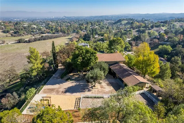 an aerial view of a house with a lake view