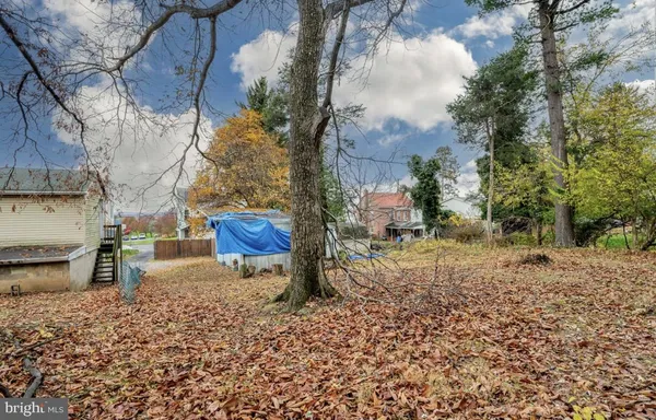 a backyard of a house with barbeque oven fire pit and outdoor seating