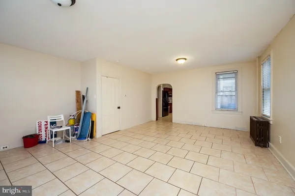 a view of a livingroom with furniture and a window