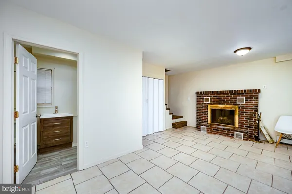 a view of an empty room and fire place