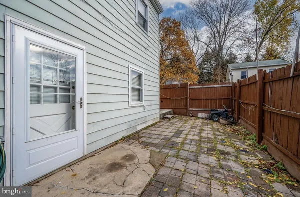 a view of a backyard with a large tree