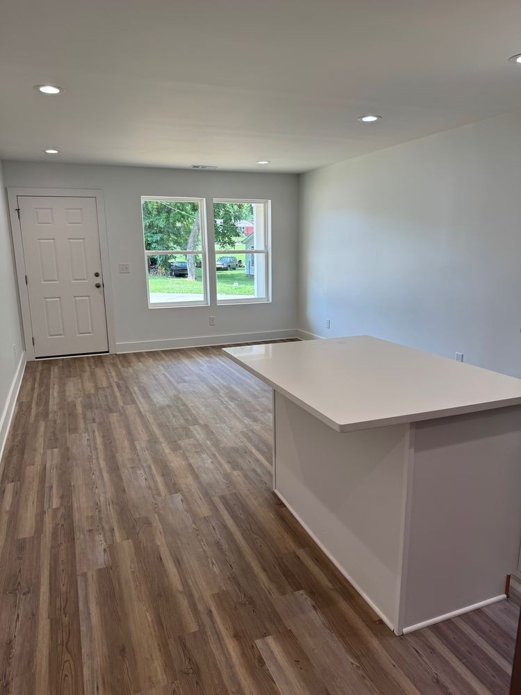 1025 Mapleash Avenue Columbia, TN 38401 - Photo 2 of 7 an empty room with wooden floor and windows