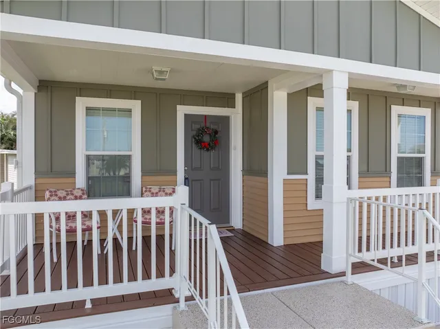 a view of a house with wooden deck