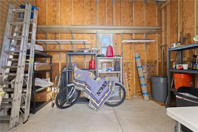a view of house with a big yard and large tree
