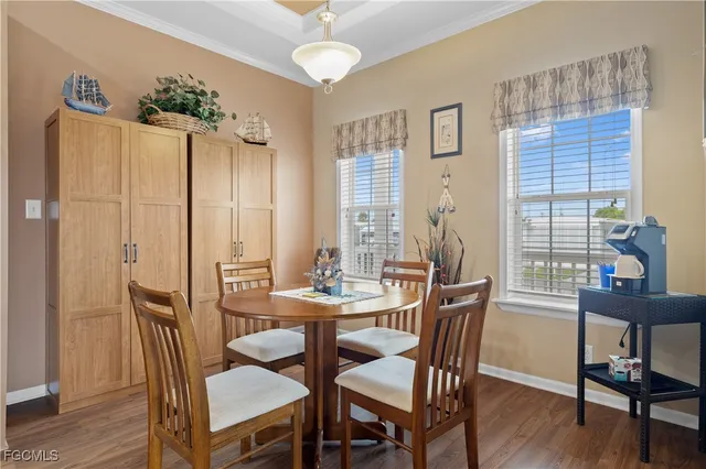 a view of a dining room with furniture and wooden floor