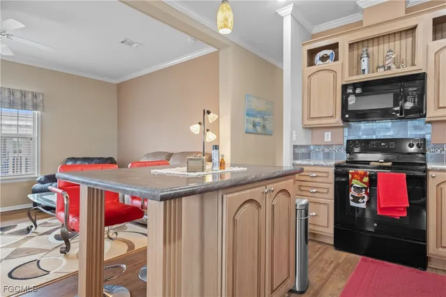 a kitchen that has a lot of cabinets in it