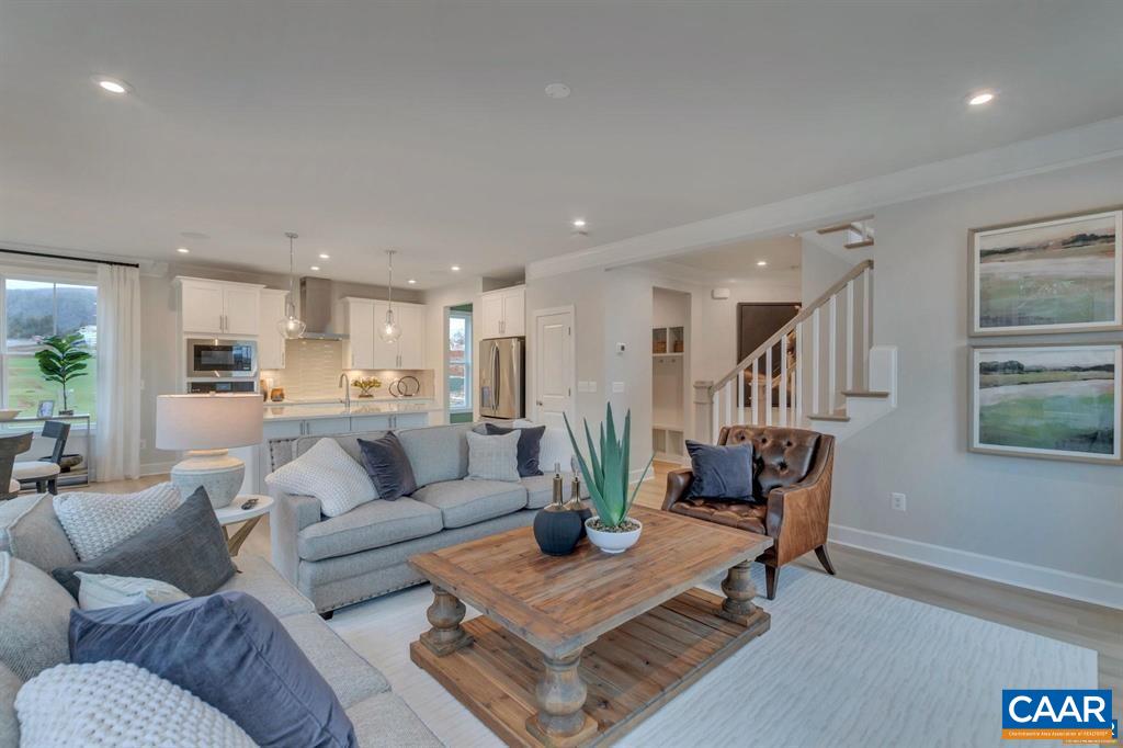 2837 Rambling Brook Lane Crozet, VA 22932 - Photo 5 of 24 a living room with furniture kitchen view and a wooden floor