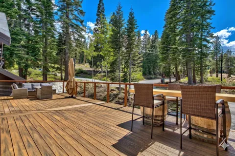 a view of a chairs on wooden deck