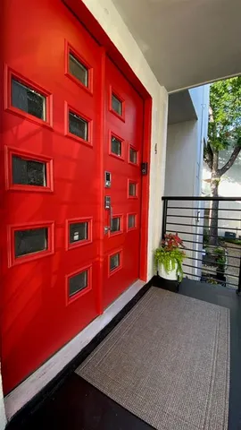 a view of a red building with many windows