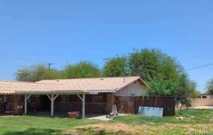 1620 Virginia Lane El Centro, CA 92243 - Photo 2 of 2 a view of a house with a yard and sitting area