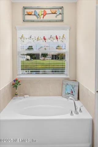 a bedroom with furniture and wooden floor