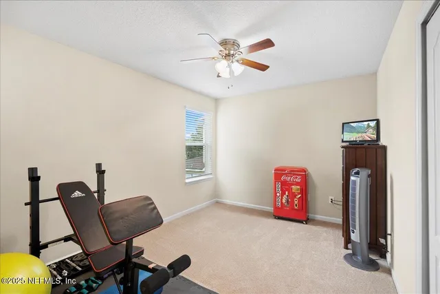 a bathroom with a sink a toilet and a window