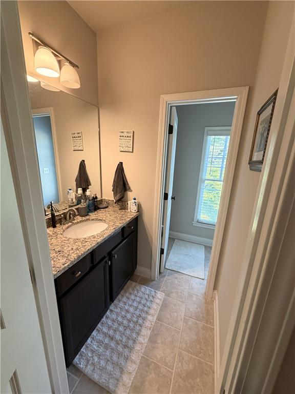 3151 Osborne Road Northeast Brookhaven, GA 30319 - Photo 28 of 54 a bathroom with a granite countertop sink and a mirror