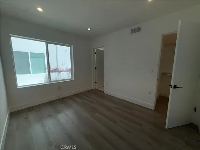 a bathroom with a shower a toilet and sink