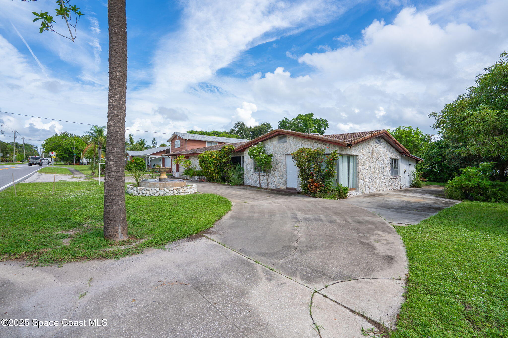 303 North Riverside Drive Indialantic, FL 32903 - Photo 2 of 7 a view of a house with a yard
