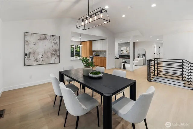 a spacious bedroom with a bed and a large window