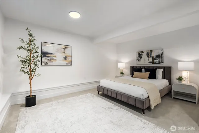 a spacious bathroom with a double vanity sink toilet mirror and shower