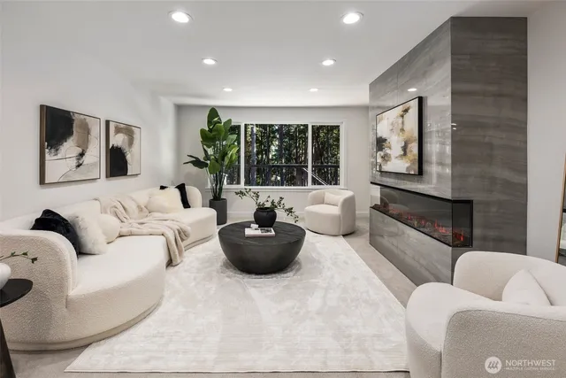 a living room with furniture and a large window