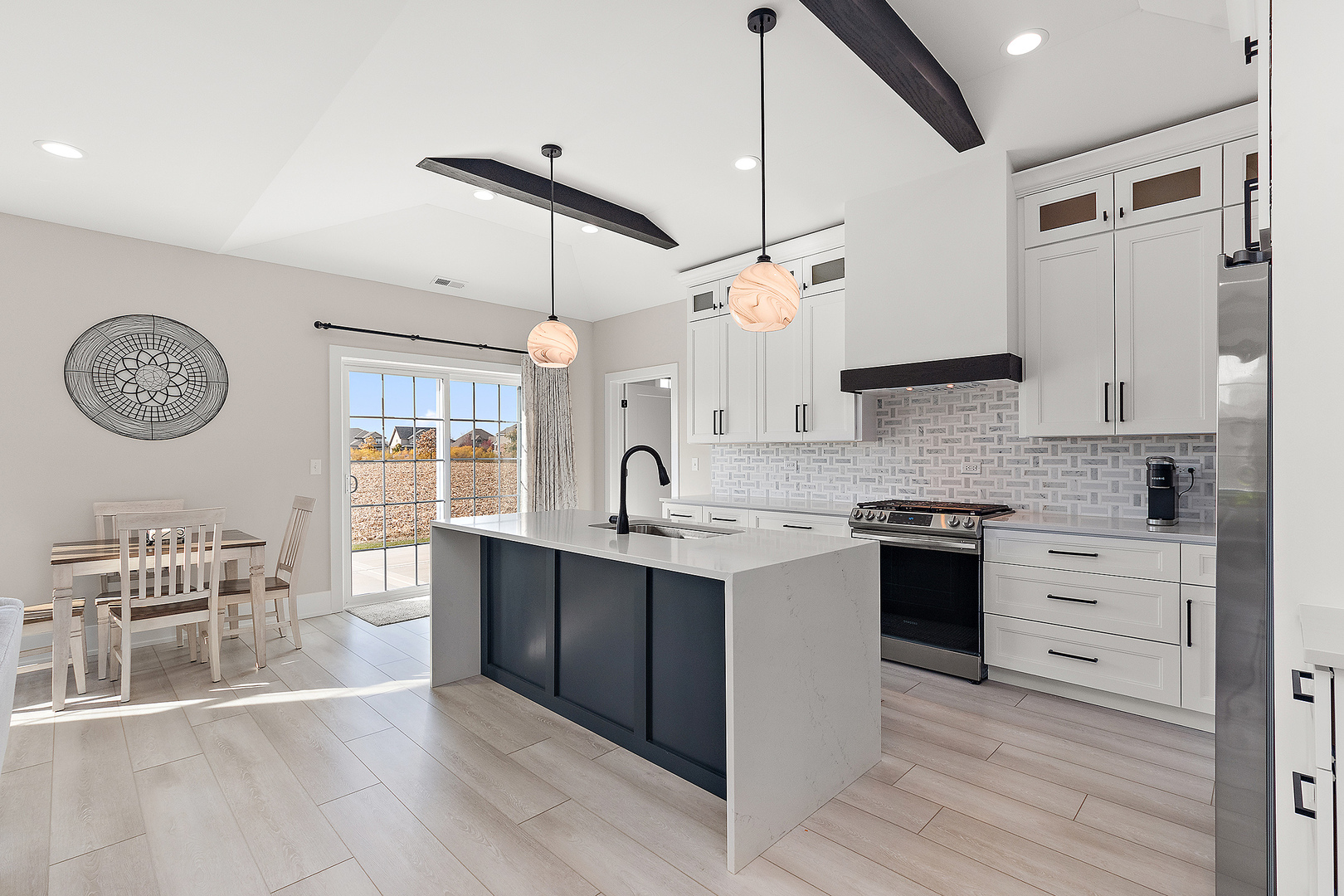 23960 Ann Court Manhattan, IL 60442 - Photo 2 of 31 a kitchen with stainless steel appliances kitchen island a chandelier