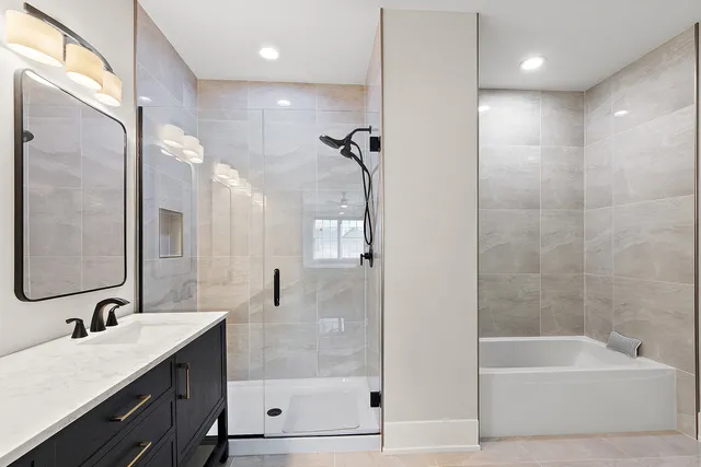 a bathroom with a double vanity sink a mirror and a shower