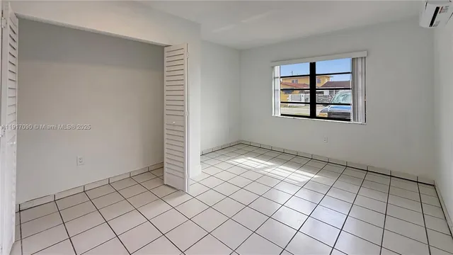 a view of an empty room and window