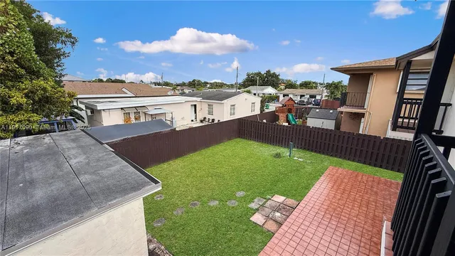 a backyard of a house with lots of green space