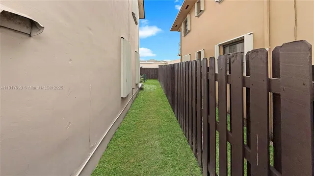 a view of a house with a backyard