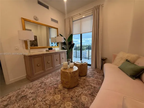 a living room with furniture and a window