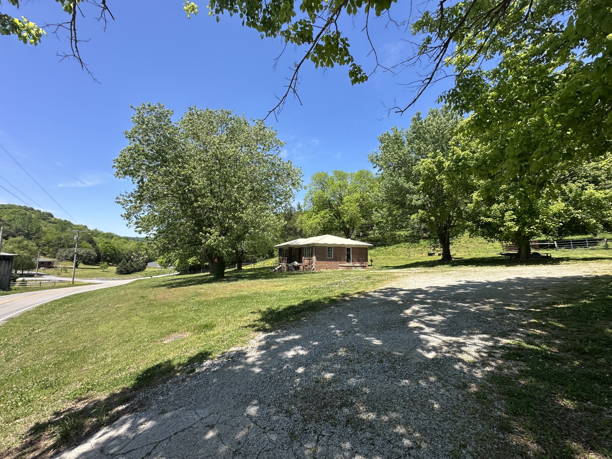 202 Maggart Road Elmwood, TN 38560 - Photo 11 of 34 a front view of a house with a yard