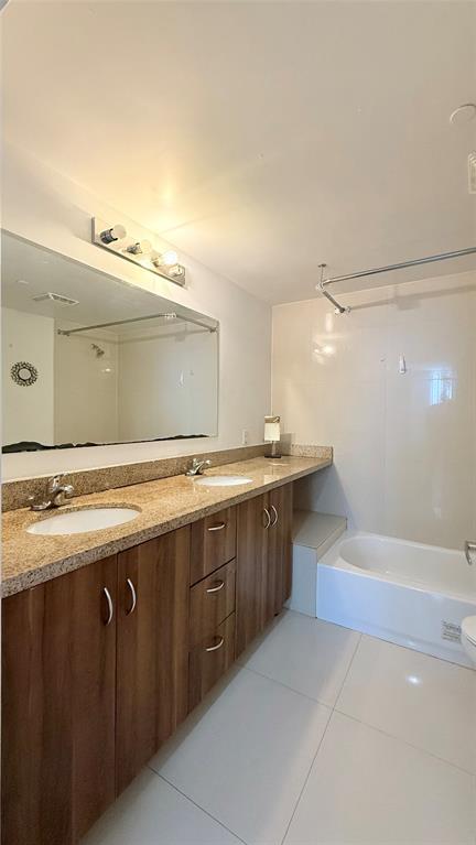601 Northeast 23rd Street, Unit 902 Miami, FL 33137 - Photo 20 of 49 a bathroom with a sink and mirror