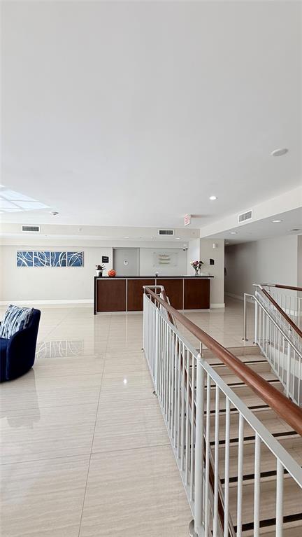 601 Northeast 23rd Street, Unit 902 Miami, FL 33137 - Photo 36 of 49 a view of front door and bedroom with furniture