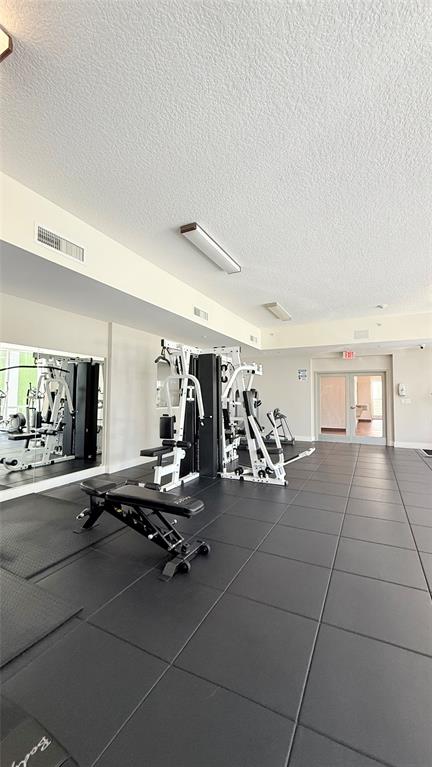 601 Northeast 23rd Street, Unit 902 Miami, FL 33137 - Photo 40 of 49 a view of a room with gym equipment