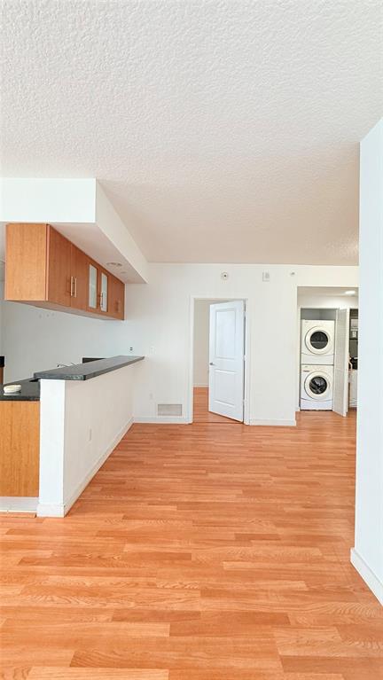601 Northeast 23rd Street, Unit 902 Miami, FL 33137 - Photo 4 of 49 a view of an empty room with wooden floor