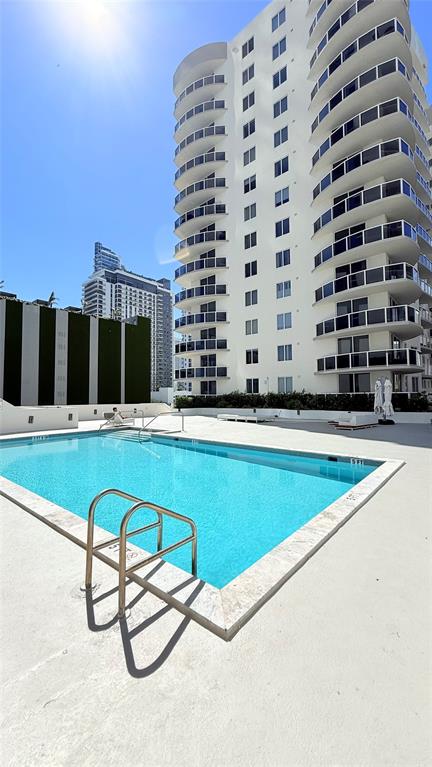 601 Northeast 23rd Street, Unit 902 Miami, FL 33137 - Photo 43 of 49 a swimming pool with view of building