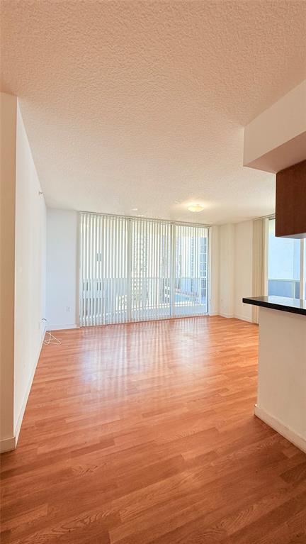 601 Northeast 23rd Street, Unit 902 Miami, FL 33137 - Photo 5 of 49 a view of a room with wooden floor and windows