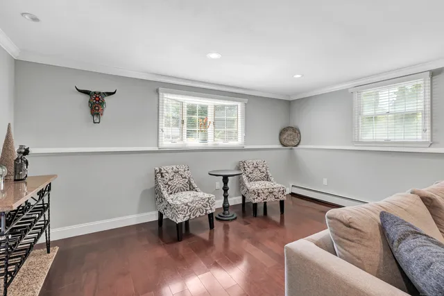 a living room with furniture and a window