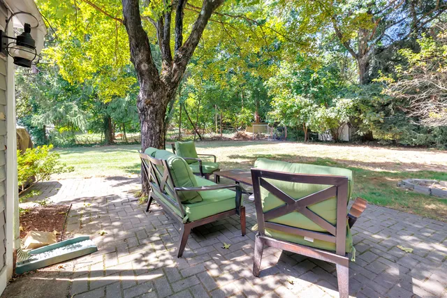 a view of a bench in a backyard