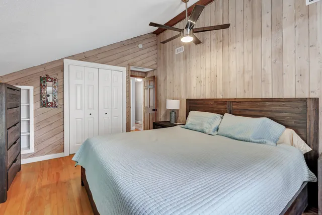 a bedroom with a bed and a dresser