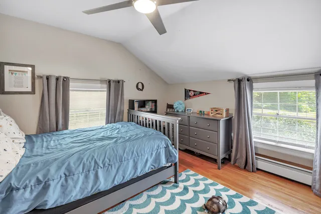 a bedroom with a bed and a dresser