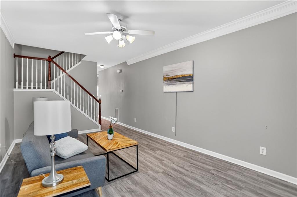 230 Valley Crossing Canton, GA 30114 - Photo 6 of 21 a living room with furniture and a lamp