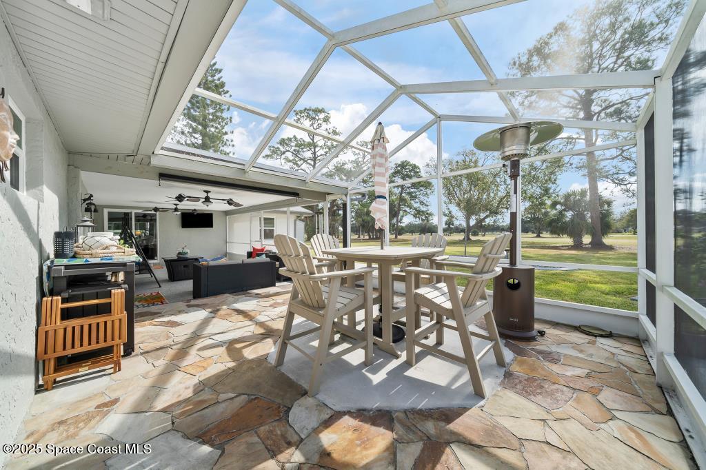1253 St Andrews Drive Rockledge, FL 32955 - Photo 31 of 33 a view of a porch with furniture and garden