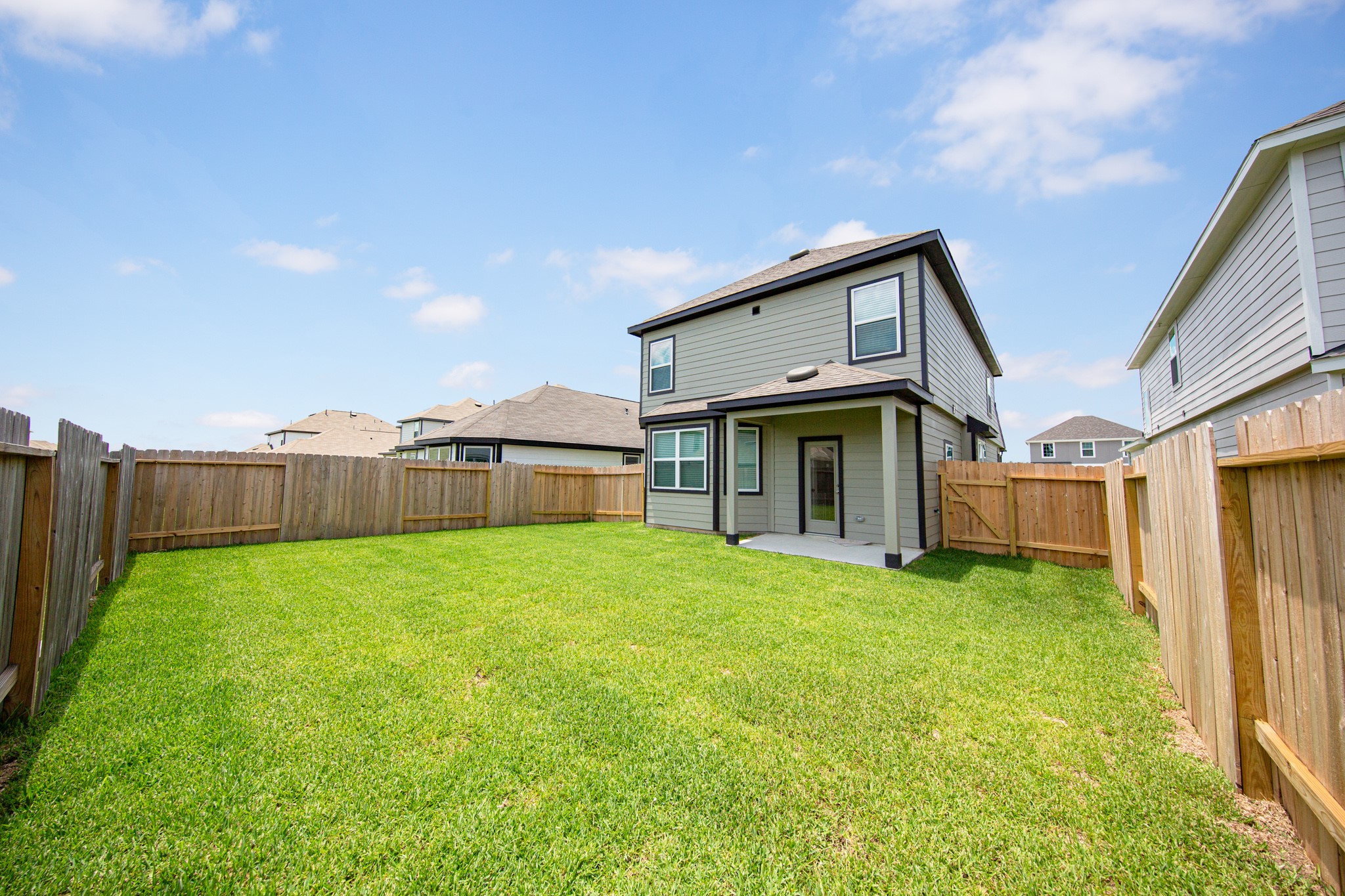 13651 Kit Run Splendora, TX 77372 - Photo 18 of 27 a view of a house with backyard and porch