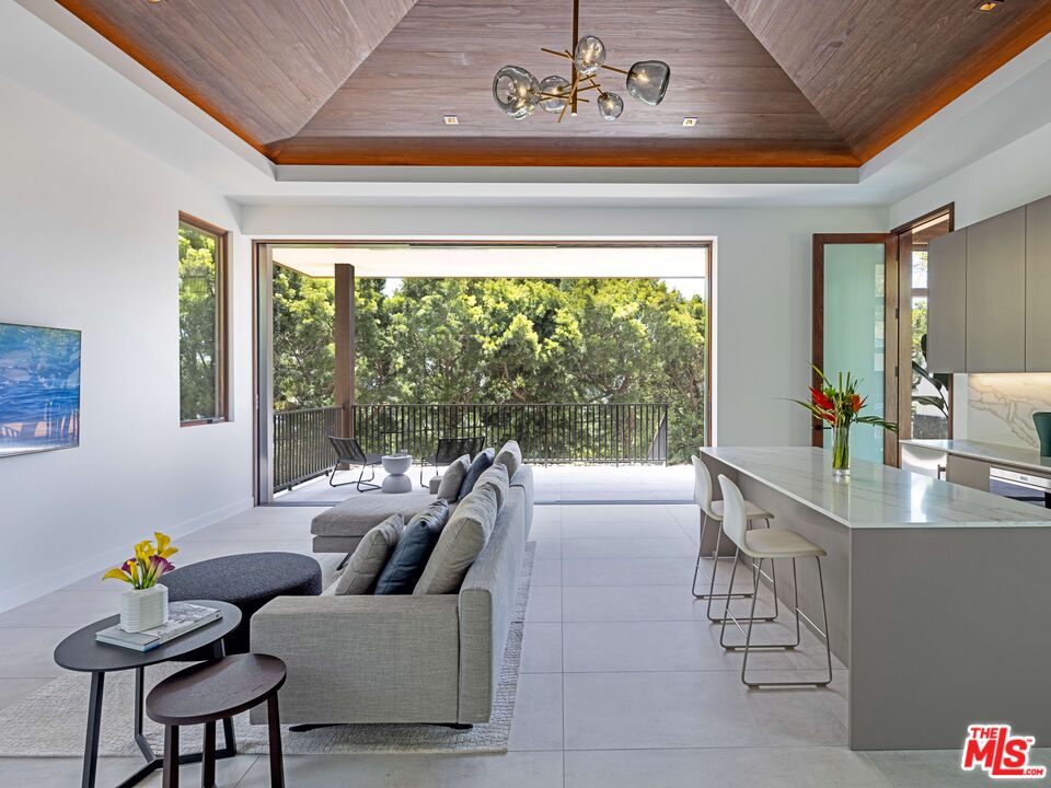 11809 Ellice Street Malibu, CA 90265 - Photo 13 of 39 a living room with furniture and a table