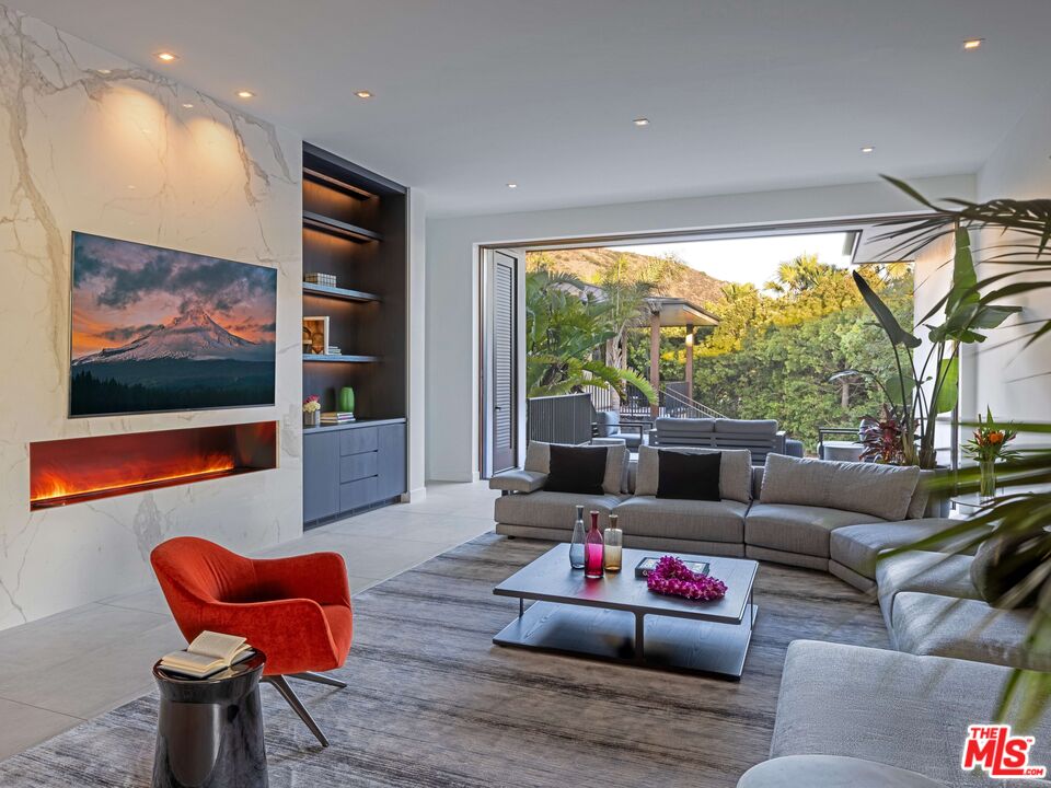 11809 Ellice Street Malibu, CA 90265 - Photo 15 of 39 a living room with furniture and a flat screen tv