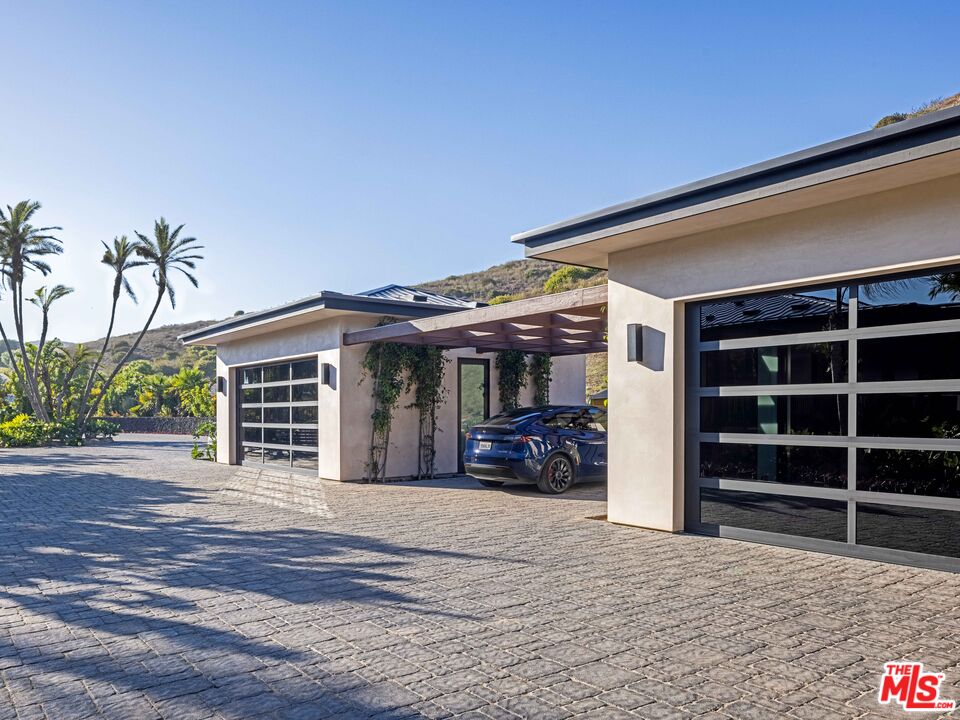 11809 Ellice Street Malibu, CA 90265 - Photo 34 of 39 a view of a house with a yard and wooden floor